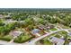 Aerial view of a home with generous sized lot outlined in red at 6310 Gainsboro Ave, Spring Hill, FL 34609