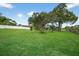 Lush, green backyard with mature trees and plenty of open space at 6310 Gainsboro Ave, Spring Hill, FL 34609