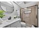 Modern bathroom with glass-enclosed shower, sleek fixtures, and white marble countertop at 6310 Gainsboro Ave, Spring Hill, FL 34609