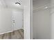 Clean entryway area with neutral colors and flooring, and a closet for storage at 6310 Gainsboro Ave, Spring Hill, FL 34609