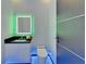 Modern half bathroom with LED mirror and lighting at 6530 Simone Shores Cir, Apollo Beach, FL 33572