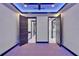 Bright bedroom with recessed lighting, and modern doors to bathrooms and walk-in closet at 6530 Simone Shores Cir, Apollo Beach, FL 33572