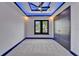 Modern bedroom features a walk-in closet, a large window, and modern recessed lighting at 6530 Simone Shores Cir, Apollo Beach, FL 33572