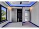 Bedroom featuring a large closet, a door, and modern lights at 6530 Simone Shores Cir, Apollo Beach, FL 33572