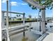 View of a private boat lift on the canal for easy access to boating and water activities at 6530 Simone Shores Cir, Apollo Beach, FL 33572