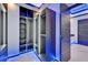 Modern walk-in closet with custom shelving, drawers, and ample storage, enhanced by stylish LED lighting at 6530 Simone Shores Cir, Apollo Beach, FL 33572