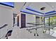 Second-floor hallway featuring modern lighting, glass railings, and sleek design at 6530 Simone Shores Cir, Apollo Beach, FL 33572