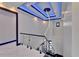 Staircase area with unique lighting and modern glass railing at 6530 Simone Shores Cir, Apollo Beach, FL 33572