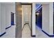 Hallway with modern doors, lighting, and marble floors at 6530 Simone Shores Cir, Apollo Beach, FL 33572