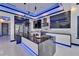 Modern kitchen features an island, stainless steel appliances and glossy cabinets and countertops with LED lighting at 6530 Simone Shores Cir, Apollo Beach, FL 33572