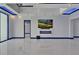 Open-concept living room with large windows, marble floors, and modern fireplace at 6530 Simone Shores Cir, Apollo Beach, FL 33572