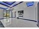 Spacious living area with modern fireplace, marble floors, and open floor plan at 6530 Simone Shores Cir, Apollo Beach, FL 33572