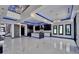 Spacious living area with open kitchen, marble floors, and modern lighting at 6530 Simone Shores Cir, Apollo Beach, FL 33572