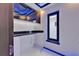 Modern pantry features storage cabinets, marble floors, and recessed lighting at 6530 Simone Shores Cir, Apollo Beach, FL 33572