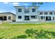 This home features a beautifully maintained lawn and patio, creating a perfect outdoor retreat at 6530 Simone Shores Cir, Apollo Beach, FL 33572