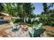 Enjoyable backyard features seating and a fire pit, ideal for outdoor gatherings and relaxation at 6618 N 11Th St, Tampa, FL 33604