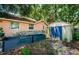 A backyard featuring planter boxes, a storage shed and the exterior of the house at 6618 N 11Th St, Tampa, FL 33604