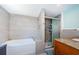 Bathroom featuring a soaking tub, shower, and granite vanity at 6618 N 11Th St, Tampa, FL 33604