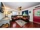 Spacious living room with comfortable seating, hardwood floors, and plenty of natural light at 6618 N 11Th St, Tampa, FL 33604