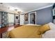 Spacious bedroom features hardwood floors, a ceiling fan, and natural light at 6618 N 11Th St, Tampa, FL 33604