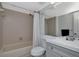 Updated bathroom featuring tile surround, tub, and vanity at 6817 Stones Throw N Cir # 17203, St Petersburg, FL 33710
