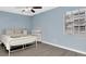 Bright bedroom featuring neutral tones, large window, and ample closet space for storage at 6817 Stones Throw N Cir # 17203, St Petersburg, FL 33710