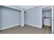 Bonus room featuring modern flooring and an adjacent laundry area at 6817 Stones Throw N Cir # 17203, St Petersburg, FL 33710