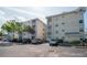 Exterior view of the building with ample parking, and landscaped grounds at 6817 Stones Throw N Cir # 17203, St Petersburg, FL 33710
