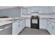 Well-lit kitchen boasts ample cabinetry, modern appliances, and durable countertops at 6817 Stones Throw N Cir # 17203, St Petersburg, FL 33710