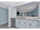 Kitchen features breakfast bar that opens to the living room at 6817 Stones Throw N Cir # 17203, St Petersburg, FL 33710