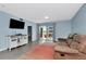 Living room with a sliding glass doors opening to a balcony at 6817 Stones Throw N Cir # 17203, St Petersburg, FL 33710