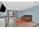 Comfortable living room with a sliding glass doors opening to a balcony at 6817 Stones Throw N Cir # 17203, St Petersburg, FL 33710