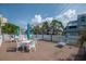 Outdoor lounge with ample seating near community pools and lush landscaping, perfect for relaxation and socializing at 6817 Stones Throw N Cir # 17203, St Petersburg, FL 33710