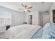 Bedroom featuring white walls, ceiling fan, and closet access at 71 Rose Bud Ln, Spring Hill, FL 34609