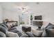 Cozy living room with a comfortable seating arrangement, a stylish rug, and a bright, airy atmosphere at 71 Rose Bud Ln, Spring Hill, FL 34609