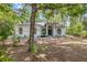 Charming one-story home with a well-maintained front yard and mature trees at 7644 Conrad St, Wesley Chapel, FL 33544