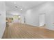 Spacious living area featuring vaulted ceilings and wood-look flooring at 7644 Conrad St, Wesley Chapel, FL 33544