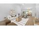 Open living room featuring dining area and modern decor at 7644 Conrad St, Wesley Chapel, FL 33544