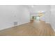 Open living space with light wood-look floors and recessed lighting at 7644 Conrad St, Wesley Chapel, FL 33544