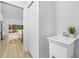 Mud room featuring a utility sink and a view into an open kitchen at 7644 Conrad St, Wesley Chapel, FL 33544
