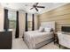 Comfortable bedroom featuring a ceiling fan, three windows, and ample natural light at 918 Sombra Street, Tampa, FL 33619