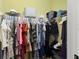 Organized walk-in closet with shelving and hanging space for wardrobe storage at 918 Sombra Street, Tampa, FL 33619