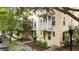Charming townhomes feature colorful facades, small balconies, and landscaped front yards at 918 Sombra Street, Tampa, FL 33619