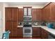 Well-equipped kitchen with stainless steel appliances, tile backsplash, and ample cabinetry at 918 Sombra Street, Tampa, FL 33619