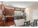 Spacious kitchen with stainless appliances, wood cabinets, and a breakfast nook with table at 918 Sombra Street, Tampa, FL 33619