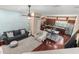 Spacious living room providing hardwood floors, open layout, and seamless flow to the kitchen at 918 Sombra Street, Tampa, FL 33619