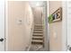 Cozy staircase with carpeted steps and a handrail, perfect for easy access to the next level at 918 Sombra Street, Tampa, FL 33619