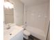 Renovated bathroom featuring subway tile shower and modern vanity with countertop sink at 9217 Tudor Dr # A106, Tampa, FL 33615