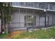 The screened patio offers a relaxing outdoor space with access to the grassy area at 9217 Tudor Dr # A106, Tampa, FL 33615