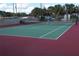 Outdoor tennis court provides a recreational amenity for active residents in the community at 9217 Tudor Dr # A106, Tampa, FL 33615